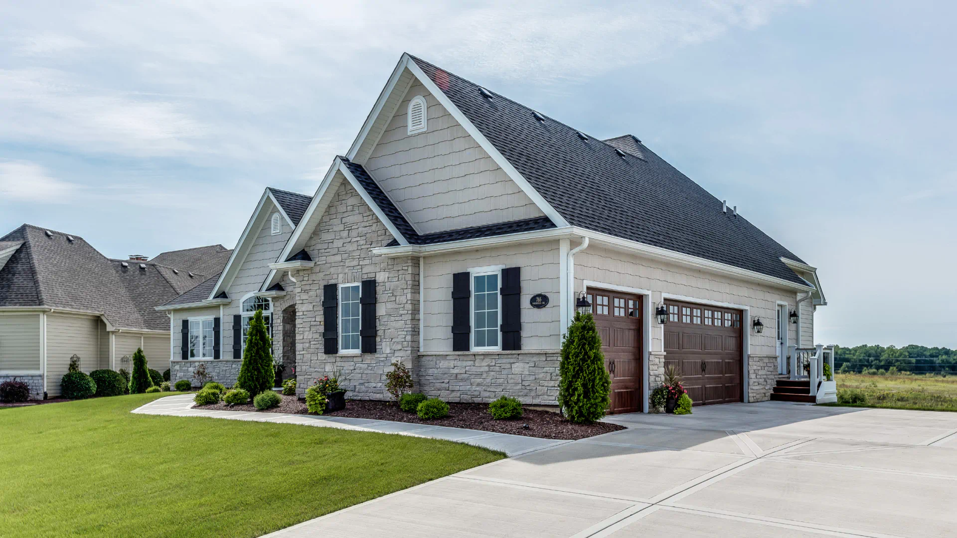 simple residential house with wide and open driveway